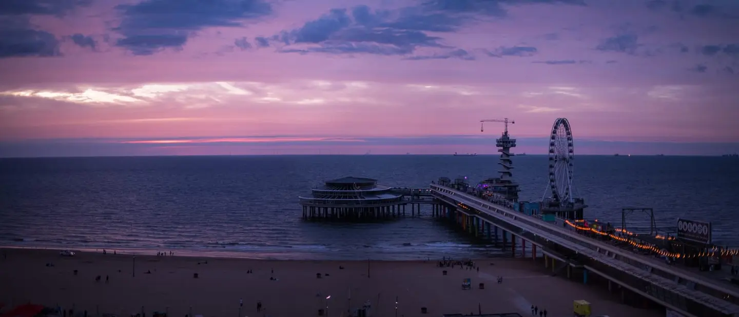 The North Sea coast at Scheveningen — De Pier, the Kurhaus, and the wide beach under Dutch skies, from blazing sunsets to rare noctilucent nights.