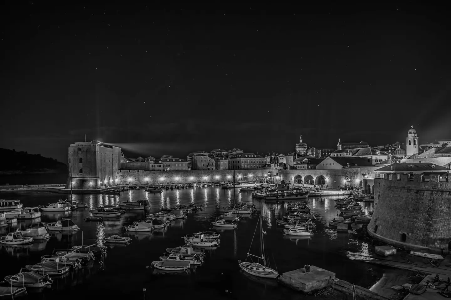 Dubrovnik's medieval harbor lies still at midnight.